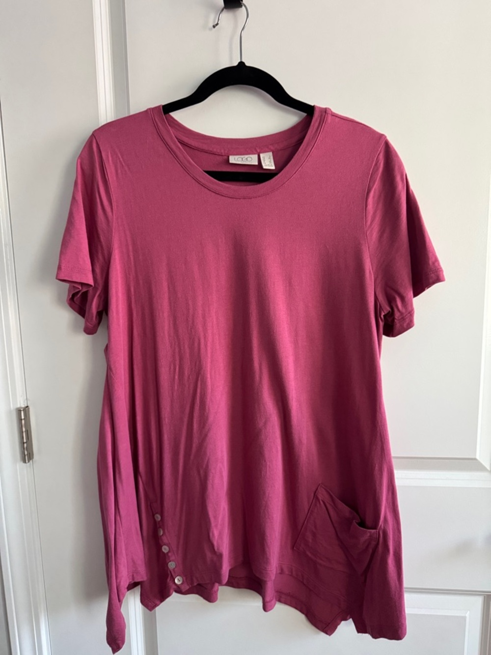 LOGO by Lori Goldstein top with sharkbite hem.
